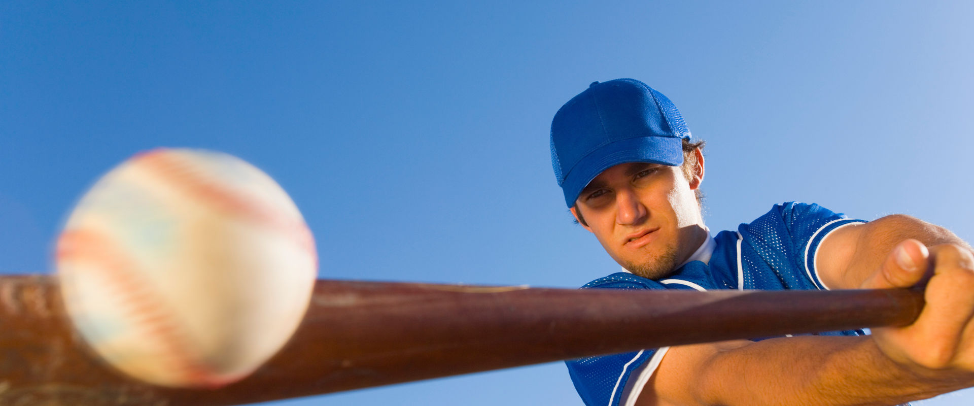 Baseball player swinging a bat.